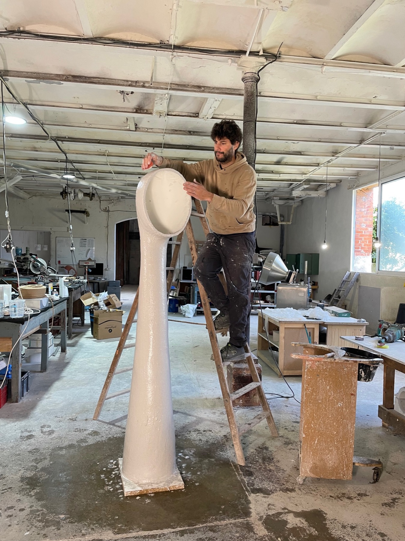 Henri Dejeant at work on a tall Amba